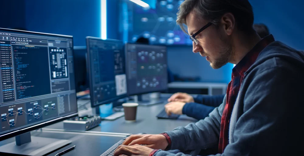 people working on computers in an office